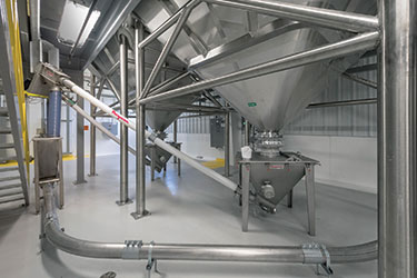 Bulk Bag Dischargers, Flexible Screw Conveyors Double Output at Peanut Butter Facility